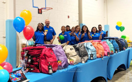 Donation of backpacks and school supplies to 12 schools across the United States