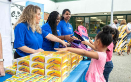 Donation of backpacks and school supplies to 12 schools across the United States