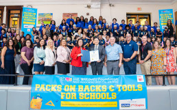 Donation of backpacks and school supplies to 12 schools across the United States